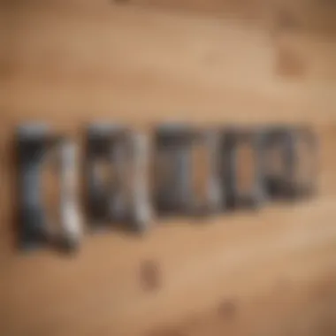 An array of different types of steel brackets displayed against a wooden background.
